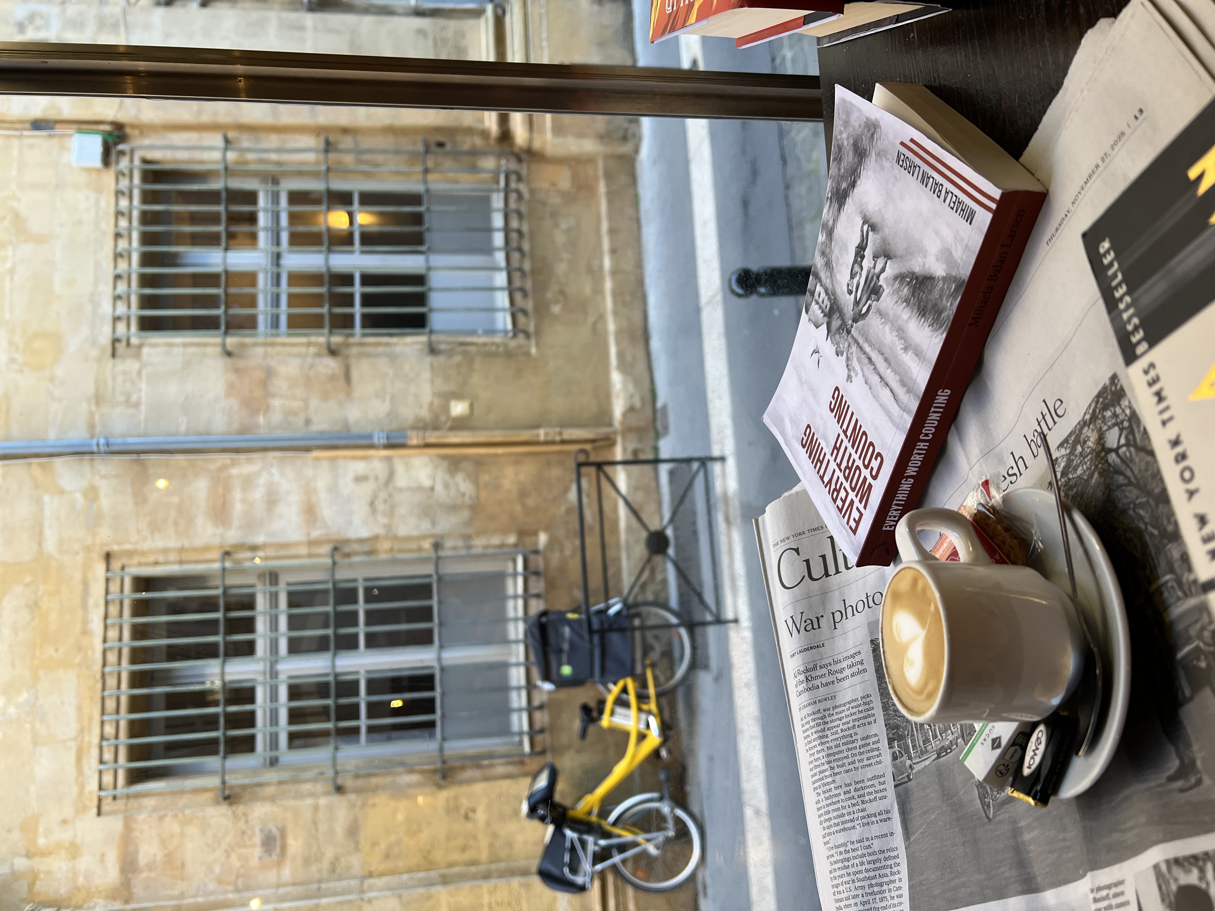 Coffee and books flatlay - coming of age historical fiction book recommendation - if you liked A Gentleman in Moscow